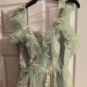 Green flowery floor length dress.